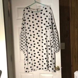 A black and white polka dot dress